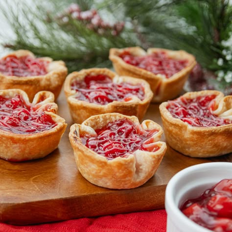 Learn how to make mini cherry pies with this easy recipe. In just 15 minutes, you can prep these two-ingredient cherry tarts with Pillsbury™ Pie Crust and cherry pie filling. Baking has never been so simple. Have your little chefs lend a hand and serve these individual cherry pies for any occasion. Cherry Biscuit Dessert, Easy Mini Cherry Pies, Crescent Roll Recipes Dessert With Cherry Pie Filling, Cherry Pie Tarts, Cherry Pie Mini, Cookies With Cherry Pie Filling, Mini Cherry Tarts, Individual Cherry Pies, Cherry Pie Bites Crescent Rolls