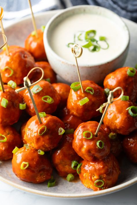 Plate of buffalo chicken meatballs skewered with serving toothpicks, nestled next to a white dish of ranch dressing dipping sauce. Buffalo Meatballs, Meatball Skewers, Chicken Meatballs Recipe, Ranch Dressing Dip, Southern Comfort Recipes, Chicken Skewer Recipe, Buffalo Chicken Meatballs, Chicken Wing Sauces, Chicken Meatball Recipes