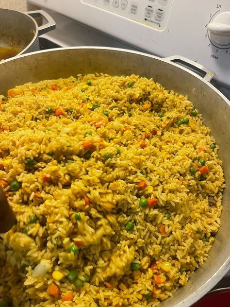 Nigerian fried rice is a rice dish that’s made with meats, mixed veggies (carrots, peas, sweet corn, green beans) and spices. Like jollof rice, It is a common feature in parties. What makes this recipe authentic is the use of liver and shrimps as the protein of choice. Jollof Rice Nigerian, Fried Rice And Chicken, Nigerian Fried Rice, Rice Meat, Nigeria Food, African Recipes Nigerian Food, Mixed Veggies, Cultural Food, Africa Food