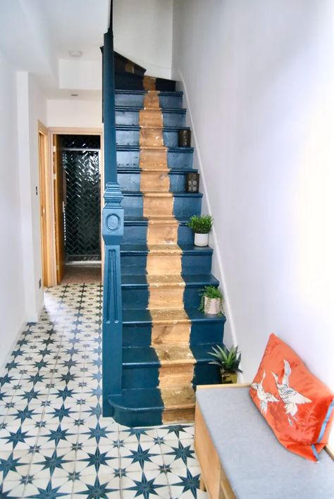 This Colorful London Home Isn’t Afraid of White Walls | Apartment Therapy Tile Stair Landing, Blue Painted Staircase, Blue Stairs Painted, Navy Blue Stairs, White Walls Apartment, Iceland Cabin, Entryway Landing, Blue Staircase, Blue Stairs