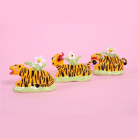 Naomi Anderson-Subryan on Instagram: ““ROAR!!” Introducing the Tiger Planter, from my Degree Show final piece entitled “The Collection” #tiger #ceramics #collection #daisy #roar” Ceramics Sculptures, Spongebob Painting, Independent Study, Feather Duster, Colorful Ceramics, New Story, Clay Art Projects, Ceramics Ideas Pottery, Sculpture Clay