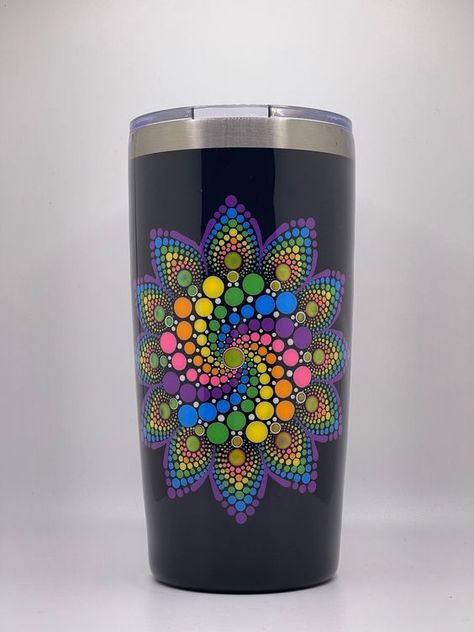 This fun and colorful tumbler is made out of black double wall vacuum insulated stainless steel and hand painted with a colorful, dotted mandala design, that is thermochromic and mood changing The colors shift from 12 different shades depending on temperature and will change with your body heat like a mood ring. The tumbler has been painted with non-toxic acrylic paint, and coated with epoxy resin to preserve the colors, making it safe to hand wash.  Tumbler holds approximately 20oz. This fun, c Painted Tumblers, Mandala Mug, Dotted Mandala, Travel Coffee Cup, Mood Ring, Dot Art Painting, Dot Art, Body Heat, Dots Art