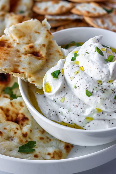 Whipped Feta is a an easy dip packed with fresh flavors. Feta cheese blended smooth and creamy with lemon and garlic. Eat with chips, pita, or crackers! Garlic Whipped Feta, Whipped Feta, On The Side, Pita, Feta Cheese, Crackers, Feta, Dip, Garlic