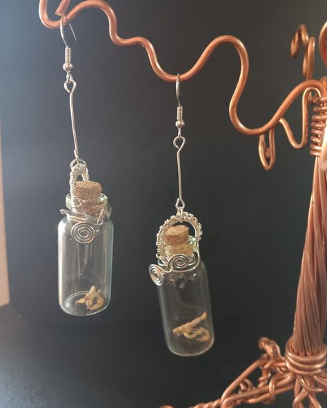 ✨ Just In! ✨ Unveil the enchantment with our Scorpion Glass Bottle Earrings! These stunning earrings feature delicate glass bottles with scorpion tails and claws, elegantly wrapped in silver wire and chain. Perfect for adding a whimsical touch to any look. #BeStubborn #StubbornSloths #NewArrivals #Handcrafted #UniqueJewelry #ArtisticVibes https://stubbornsloth.myshopify.com/products/scorpion-glass-bottle-earrings Bottle Earrings, The Enchantments, Stunning Earrings, Glass Bottle, Silver Wire, Scorpion, Sloth, Glass Bottles, Enchanted