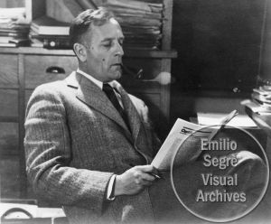 Casual portrait of Edwin Hubble reading a journal in his office. Casual Portrait, Library Rules, Edwin Hubble, Niels Bohr, Modern Physics, Space Tourism, General Relativity, Hubble Telescope, Science Geek