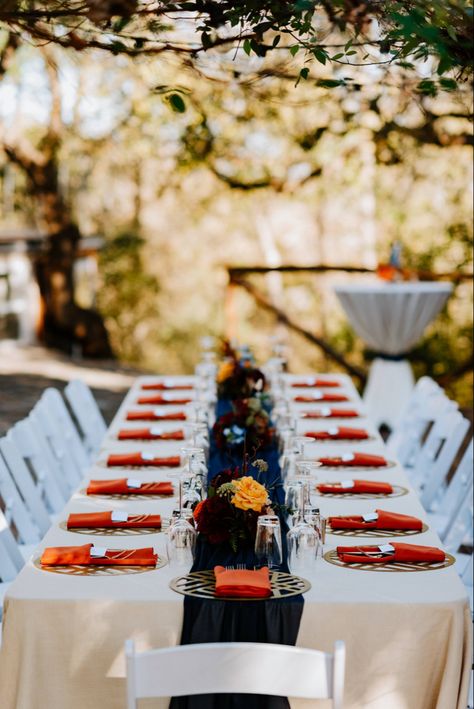 Navy Blue And Burnt Orange Wedding Reception, Navy And Orange Wedding Centerpieces, Navy Blue And Terracotta Wedding Table, Navy And Orange Table Setting, Navy And Orange Wedding Decor, Terracota And Navy Wedding Theme, Blue And Orange Aesthetic Wedding, Navy And Rust Wedding Table Decor, Terra Cotta And Navy Wedding