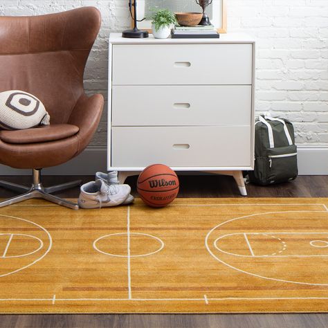 PRICES MAY VARY. FUN DESIGN: From game rooms to children’s rooms, this trendsetting basketball inspired area rug with a rich color palette instantly adds fun and festive flair to any space. DURABLE MATERIALS: Made from 100% recycled polyester with a non-skid latex backing, this area rug offers superior strength stain resistance and fade-resistant color clarity while also maintaining super soft feel, fixed shape, and precise placement. A great choice for high-traffic areas and households with kid Sports Playroom, Playroom Area, Home Basketball Court, Basketball Bedroom, A Basketball, Area Rug Sizes, Geometric Area Rug, Brown Area Rugs, Kid Spaces