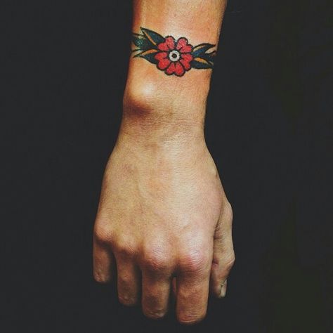 Cuff Bracelet Tattoo Traditional, American Traditional Cuff Tattoo, Wrist Tattoos Traditional, Traditional Wrist Cuff Tattoo, American Traditional Wrist Tattoo, Modern American Traditional Tattoo, Traditional Wrist Tattoo, Traditional Tattoo Wrist, Traditional Poppy Tattoo