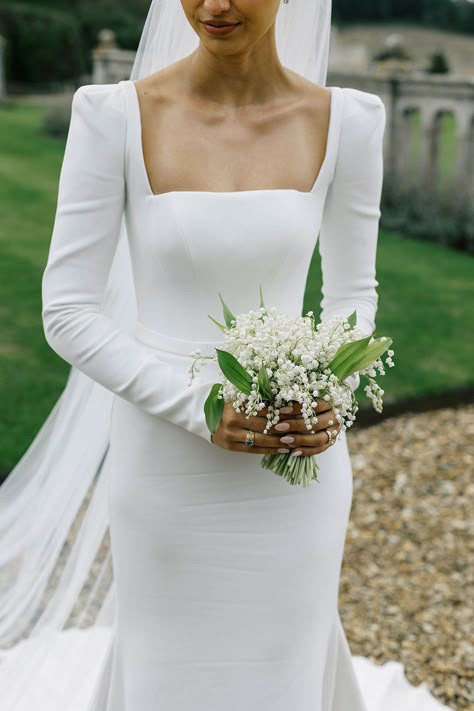 Real bride Ariana in Suzanne Neville Amber wedding dress with sleeves, square neck and corset. For a black tie wedding at Harlaxton Manor in Grantham, Lincolnshire. With a classic lily of the valley white bouquet. Dress from Miss Bush bridal boutique in Surrey, images © Emmylou Kelly #realbride #weddingdress #suzanneneville #bridalfashion #bride #sleeves #amber #squareneck #missbush #corset #blacktie #bouquet #lilyofthevalley #white Bride Sleeves, Harlaxton Manor, Bride Bouquets White, Square Neck Wedding Dress, Suzanne Neville Wedding Dresses, Classic Timeless Wedding, Simple Classic Wedding, Amber Wedding, Bouquet Dress