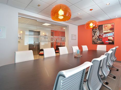 Conference room with an orange accent wall at the Central Office Wood Accent Wall Office, Accent Walls Office, Green Accent Wall Office, Black Accent Wall Office, Accent Wall Home Office, Bold Office Design, Office Accent Wall Ideas, Accent Wall Office, Orange Accent Wall