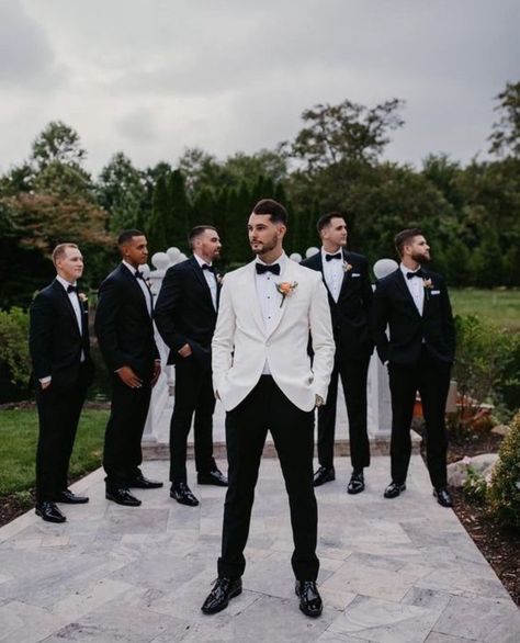 Groom Tuxedo Groomsmen Suits, Black And White Grooms Suit, Groom And Bestman Suits, White Groomsmen Suit, Formal Wedding Party Attire, Classic Groom And Groomsmen Attire, White Groom Black Groomsmen, Groom In White Groomsmen In Black, Groomsmen Attire Classic