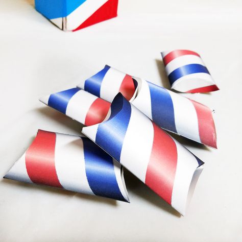 If you're throwing a barber shop themed or haircut party, or even a mustache bash, you may want to check out these free printable barber shop treat boxes - you can just print these favor boxes and they are easy to assemble and fill with inexpensive candy or favors. The fun red white and blue pillow boxes are also patriotic and great for Independence Day Barber Shop Party Ideas Decor, Barber Shop Baby Shower Theme, Barbershop Party Ideas, Barber Shop Theme Party, Miniature Barber Shop, Finger Lights, Easy Pillows, Mustache Party, Barber Shop Decor