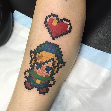 Pixel art Link tattoo done by @dachtattoos To submit your work use the tag #gamerink And don't forget to share our page too! #tattoo #tattoos #tatuaje #tatuajes #ink #videogametattoo #gamertattoo #gamerink #videogames #gamer #gaming #nintendo #nes #n64 #gamecube #wii #wiiu #3ds #nintendo3ds #link #zelda #pixelart #thelegendofzelda #linktattoo #thelegendofzeldatattoo #zeldatattoo #nintendotattoo #pixelarttattoo Ness Earthbound, Nintendo Tattoo, Tattoo Journal, Video Game Tattoos, Couple Tattoos Love, Tattoo Ink Sets, Zelda Tattoo, Gamer Tattoos, Tattoos Infinity