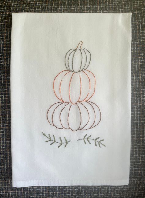 Stack of Pumpkins on flour sack tea towel #farmhousefloursack #fallkitchentowel #farmhousepumpkin Fall Embroidered Tea Towels, Hand Embroidery On Towels, Hand Embroidered Tea Towels Diy, Tea Towel Embroidery Ideas, Hand Towel Embroidery Designs, Hand Embroidery Tea Towels, Embroidered Kitchen Towels Ideas, Hand Embroidered Tea Towels, Embroidered Tea Towels Diy