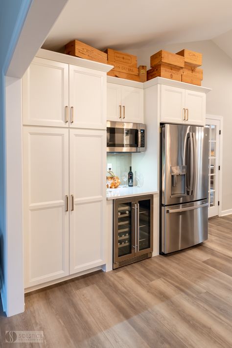 We love the multi-functional beverage center in this #kitchendesign. 🍹☕🍷 It includes cabinet storage and a beverage refrigerator for storing cold drinks. The kitchen's refrigerator and microwave are located here too, making it a space where you can easily warm up your coffee or mix a cocktail in one location. Fridge Next To Microwave, Under Counter Drink Fridge, Pantry Wall With Beverage Fridge, Storage Beside Refrigerator, Kitchen Beverage Fridge, Wine Fridge Next To Refrigerator, Refrigerator Cabinet Ideas Kitchen, Drink Refrigerator In Kitchen, Wine Fridge In Kitchen Free Standing