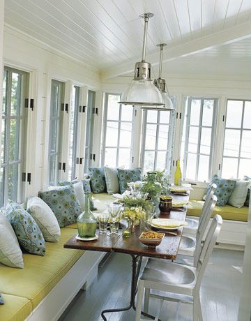 Casement windows wrap the dining room, providing wide-open views of the lake. Navy chairs from Design Within Reach. Mitchell Gold + Bob Williams pillows. Early-20th-century French factory lights from R.T. Facts. Glassware on the farm table is from Source Perrier. Gil Shafer, Sunroom Dining, Banquette Dining, Bench Seating Kitchen, Corner Seating, Lake House Kitchen, Kitchen Banquette, Sunroom Designs, Window Seats