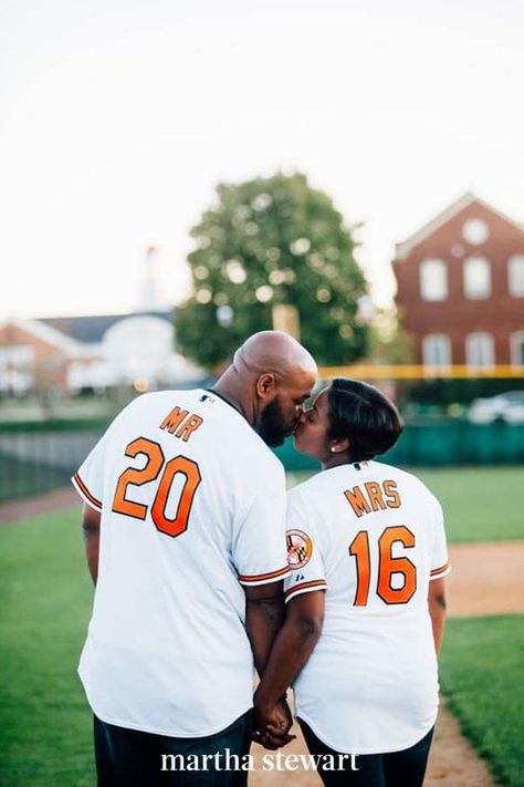 Embrace the shared interests that helped your relationship blossom by putting them on display. These two posed in custom Baltimore Orioles baseball jerseys. #weddingideas #wedding #marthstewartwedding #weddingplanning #weddingchecklist Sports Engagement Photos, Baseball Engagement Photos, Poses Fun, Sports Themed Wedding, Engagement Themes, Unique Poses, Backyard Wedding Dresses, Baseball Wedding, Beautiful Engagement Photos