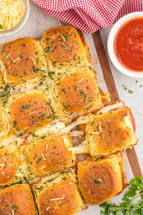 piece of pizza slider with stringy cheese Pepperoni Pizza Sliders, Pizza Sliders, Pizza Slider, Sweet Dinner Rolls, Slider Rolls, Piece Of Pizza, Bagel Bites, Cheese Tomato, Craving Pizza