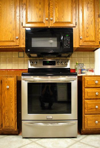 Young House Love | Filling Gaps Around The Stove With Trim and Other Little Things | https://www.younghouselove.com Cabinet Repair, Filling Cabinet, Kitchen Facelift, Small Stove, Tile Removal, Young House, Young House Love, Beverage Center, Door Frames