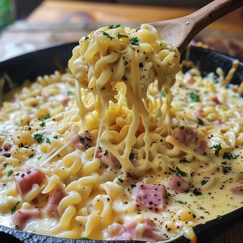 Cheesy Noodles with Ham Recipe Ingredients For the Noodles: 12 ounces egg noodles or your favorite pasta 2 cups diced ham 2 cups shredded cheddar cheese 1 cup shredded mozzarella cheese 4 tablespoons unsalted butter 1/4 cup all-purpose flour 2 cups whole milk 1 cup heavy cream 1 teaspoon garlic powder 1 teaspoon onion powder Salt and pepper to taste Fresh parsley, chopped, for garnish Instructions Cook the Noodles: Bring a large pot of salted water to a boil. Cook the egg noodles according ... Cheesy Noodles, Boil Cook, Cheddar Cheese Recipes, Ham Recipe, Shredded Cheddar Cheese, Post Workout Food, Ham Recipes, Delicious Snacks Recipes, Seafood Dinner