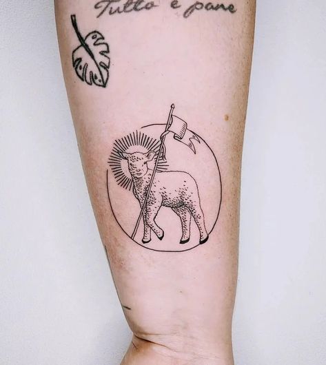 What Does a Lamb Tattoo Mean? Symbolism, Art Ideas - Parade Paschal Lamb Tattoo, Lamb Lion Tattoo, Shepherds Staff Tattoo, Lamb Face Tattoo, Lion Of Judah Lamb Of God Tattoo, Lamb With Crown Of Thorns Tattoo, Worthy Is The Lamb Tattoo, Lamb Head Tattoo, American Traditional Lamb Tattoo