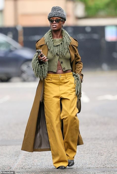 The 37-year-old donned a flamboyant ensemble when she met a friend for a coffee. The actress wore a pair of mustard coloured trousers with a relaxed straight leg fit and a dark sage green knitted cardigan, engulfed in extravagant fringe around the neck and cuffs Street Style Trousers, Fringe Boots Outfit Fall, How To Style Green Sweater, Cool Casual Outfits Women, Fringe Cardigan Outfit, Dark Green Trousers Outfit, Mustard Top Outfit, 2024 Fall Outfits, Cool Fashion Outfits