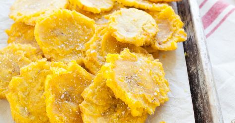 Tostones (Twice Fried Plantains) | TheNoshery.com Fried Plantains, Pumpkin Bread Pudding, Plantain Recipes, Puerto Rican Cuisine, Puerto Rican Dishes, Puerto Rico Food, Boricua Recipes, Dominican Food, Spanish Dishes