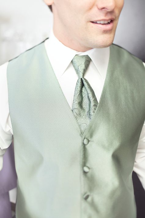 Sage green tux vest with paisley tie (possible for Robin with maybe the tux in a dark grey or sterling silver) Sage Vest Men, Tuxedo With Sage Green Tie, Sage Green Ties Groomsmen Black Suit, Sage Green Vest Groom, Sage Green Waistcoat, Black Tux With Sage Green, Sage Green Chambelanes, Black Suit With Sage Green Tie, Coquette Quince