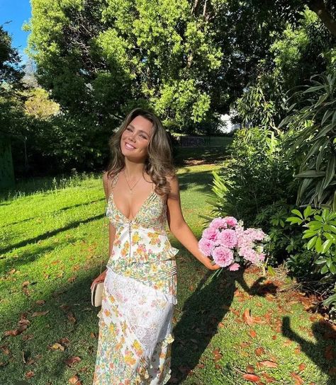 PRODUCT INFO The For Love and Lemons Rosalyn dress is a dreamy asymmetrical patchwork garden and carnation print maxi featuring a plunging neckline, fresh white floral lace panelling, and feminine pin-tucked and ruffle detailing throughout. Partially lined, delicate shoulder ties. The perfect spring fling dress! SHIPPI