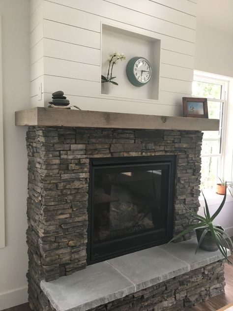 Grey Fireplace Wood Mantle, Shiplap And Rock Fireplace Wall, Black Stone And Shiplap Fireplace, Stone Farmhouse Fireplace, Fireplace With Stacked Stone, Composite Stone Fireplace, Rock Fireplace With Shiplap, Fireplaces With Shiplap And Stone, Stone Mantel Fireplace