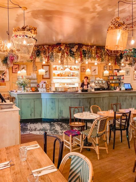 21 of the Cutest Parisian Cafés You Need To Visit - Landry Has Landed Velvet Couch Coffee Shop, Cafe Winter Aesthetic, Tea Cafe Interior Ideas, French Cafe Interior, Cafe Decoration Ideas, Parisian Cafe Aesthetic, Parisian Cafe Interior, Cafe Interior Ideas, French Cafe Aesthetic