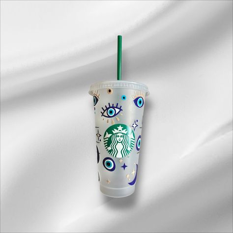 ✨ Protect your energy while sipping in style! This beautiful reusable Starbucks cup features a mystical evil eye design, symbolizing protection, positivity, and good vibes. With elegant celestial accents, this cup is perfect for those who love spiritual aesthetics and boho-inspired designs. 🌙 Cup Details: ✔️ 24oz Reusable Cold Cup ✔️ Includes Lid & Green Straw ✔️ High-Quality Vinyl Design - Durable & Long-Lasting ✔️ Perfect for Daily Use or as a Unique Gift 🔮 Perfect for: ✔️ Coffee & Tea Lovers ✔️ Spiritual & Boho Aesthetic Fans ✔️ Gifts for Friends, Coworkers & Family 💙 Stay protected and hydrated with this enchanting evil eye tumbler!