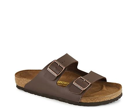 Birkenstock Arizona Men s Sandal A true pioneer of laid-back comfort, the Arizona mens Sandal from Birkenstock features the original footbed with pronounced arch support, a roomy toe box, and a deep heel cup. Two soft straps with buckles provide an adjustable fit. Birkenstock uses natural & renewable materials with a focus on environmentally friendly operations. Dual buckle closure sSuede insoleCork-latex footbedEVA outsole Mens Birkenstocks, Brown Birkenstock, Men Birkenstock, Birkenstock Men, Birkenstock Brown, Rack Room Shoes, Rack Room, Footbed Sandals, Birkenstock Sandals