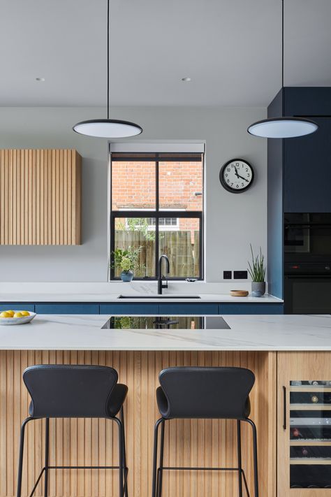 This kitchen combines blue-painted cabinet fronts with a 'Skog' style oak slatted island and cabinets, creating a welcoming and timeless space. The blend of rich blue tones and natural oak accents brings warmth and sophistication to the heart of the home. #TimelessElegance #HomeInspo #ScandinavianStyle https://www.solakitchens.com/slate-blue/ Slatted Island, Blue And Timber Kitchen, Blue And Oak Kitchen, Blue Kitchen Oak Worktop, Navy Handleless Kitchen, Blue Kitchen Wooden Worktop, Montauk Blue Slate Tile, Blue Painted Cabinets, Painted Cabinet