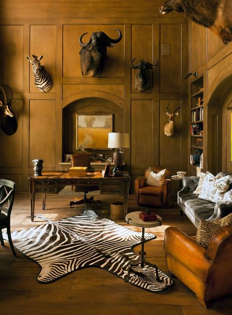 African Safari Decor. Wild and bold prints are the best descriptions for African home decor. The African inspired home decorating style makes use of animal and tribal patterns to come up with a stylish, warm, and inviting home. Adding African and Safari themed ideas to your home is a great way to inject a feeling of adventure into your rooms. Safari Living Rooms, African Safari Decor, Safari Home Decor, Taxidermy Decor, Safari Decor, Traditional Home Office, Hunting Room, Safari Decorations, Trophy Rooms