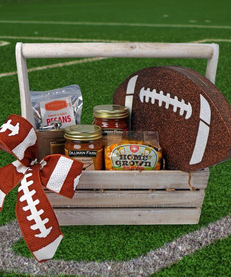 GIFT BASKET, FOOTBALL, SUPER BOWL, GIFTS This football crate is overflowing with local goodies meant for the big game! Enjoy "Indy Style" popcorn from Just Pop In, Salsa and Honey Mustard Dipping Sauce from Dillman Farm, Sweet & Spicy Pecans from Newfangled confections, and a flask (where you can enjoy whatever you would like!)  Decorated with a giant foam football and football ribbon, ready to rumble! Football Bouquet Gift Ideas, Football Raffle Basket Ideas, Basket Raffle Ideas Unique, Senior Night Baskets Football, Football Gift Baskets, Super Bowl Gifts, Quarter Auction, Chicago Bears Gifts, Spicy Pecans