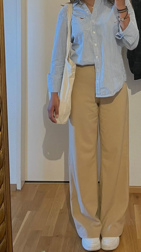 Tote bag, white shoes, casual outfit, trousers, buttoned shirt Western Fashion Outfits Casual, Tomboy Assesories, Beige Pants Outfit Women Summer, Beige Trousers Outfit Summer, Cream Pant Outfits Women, Beige Shirt Outfits Women, Cream Pants Outfit Women, Khaki Trouser Outfit Women, Beige T Shirt Outfit