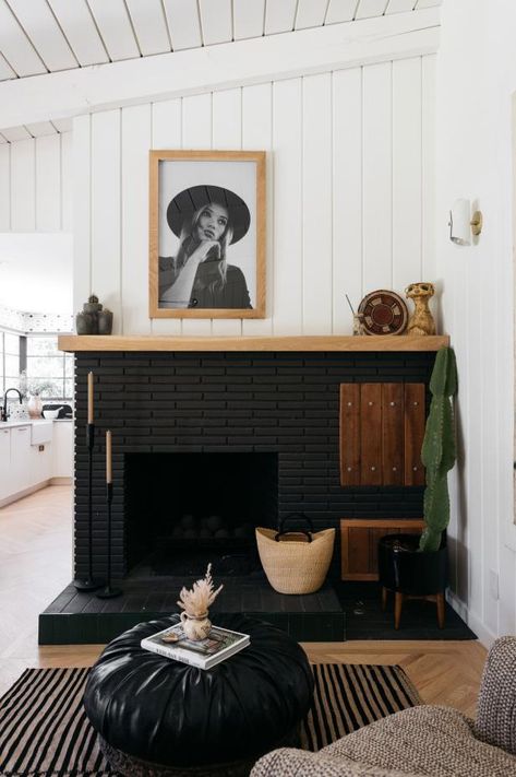 Stark Black Fireplace Against White Wooden Wall Kirsten Blazek, Black Brick Fireplace, Design Camino, White Brick Fireplace, Simple Fireplace, Painted Brick Fireplace, Painted Brick Fireplaces, Mid Century Ranch, Brick Fireplace Makeover