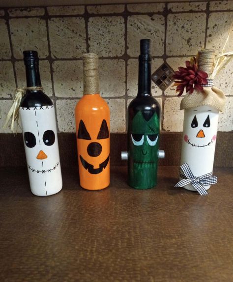 Seasonal Wine Bottle Decor, Great center pieces, for every holiday table or mantel. Made to order Frankenstein Wine Bottle, Fall Wine Bottles Diy, Christmas Crafts With Wine Bottles, Things To Do With Wine Bottles, Wine Bottle Art Projects, Halloween Wine Bottles Diy, Liquor Bottle Decor, Recycled Wine Bottle Art, Holiday Wine Bottle Crafts