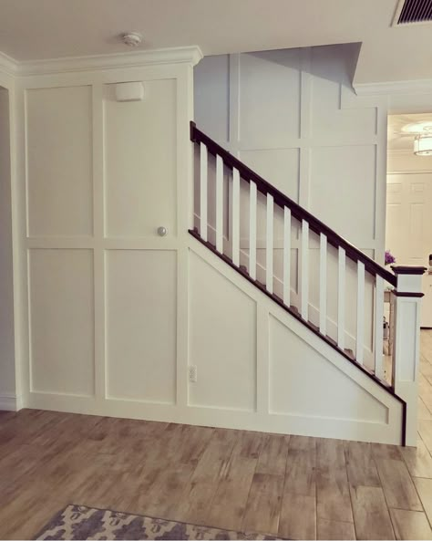 Waynes Coating On Stairs, Board And Batten Under Stairs, Board And Batten Half Wall Stairs, Basement Stairs Wall Ideas, Stairwell Wainscoting, Stairs With Walls On Both Sides, Stair Well Wall Ideas, Wall Under Stairs, Basement Railing