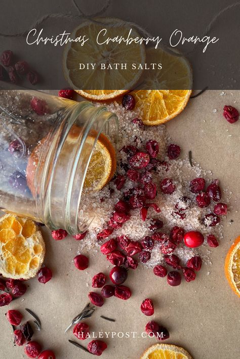 These quick, festive, and beautiful DIY Christmas bath salts are made with dried oranges and cranberries, herbs, and essential oils. For a thoughtful holiday gift, put them in a cute jar and tie it up with some jute and a handwritten label. Orange Bath Salts Diy, Bath Salts Container Ideas, Diy Christmas Gifts With Essential Oils, Homemade Christmas Bath Salts, Christmas Bath Products Diy, Holiday Bath Salts Diy, Winter Bath Salts Diy, Epsom Salt Gifts Diy, Diy Christmas Bath Salts