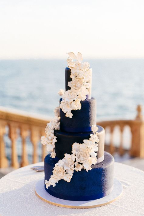 Classic Elegant Wedding Reception Decor, Round Tables with White Tablecloths and Navy Blue Linens, Gold Chairs, White and Greenery Floral Low Centerpieces | Sarasota Historic Waterfront Wedding Venue Ca d’Zan at The Ringling Museum | Tampa Bay Wedding Planner NK Productions Wedding Colors 2025, Bridesmaid Dresses White, Navy Blue Wedding Cakes, Navy Blue Bridesmaid, Large Bridal Parties, Ringling Museum, Navy Blue Bridesmaids, Blue White Weddings, White Bridal Gown