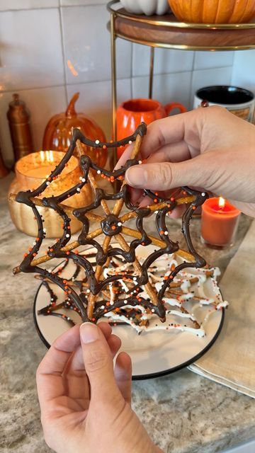 Sheri Wilson on Instagram: "Spooky Spiderwebs 🕸️🍫 these were so easy to make and perfect if you’re like me and love a sweet and salty combo!   -pretzel sticks -melting chocolate, white or dark -Halloween sprinkles  Place 8 pretzels onto parchment paper in a star shape. Melt the chocolate wafers according to the package directions, then pipe onto the pretzels to look like spiderwebs. Cover in sprinkles before the chocolate has set.   #halloweentreats #halloweencountdown #halloweenvibes #halloweenaesthetic #halloweenfood #spookyseason #spookytreats #autumnmood" Spiderweb Pretzel Sticks, Chocolate Pretzel Spiderwebs, Spiderweb Chocolate Pretzels, Spider Web Pretzels White Chocolate, Halloween Dipped Pretzel Rods, Spiderweb Dessert, Halloween Pretzel Sticks, Spiderweb Pretzels, Pretzel Spiderwebs