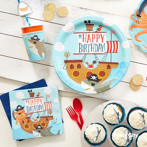 Set sail for a birthday adventure! These Pirate Shark Lunch Plates are ready for the bounty of food at your little buccaneer’s birthday! These plates feature a charming illustration of a pirate ship with the words “happy birthday!” on the main sail and a motley crew of swashbuckling creatures: a parrot, crab, and a shark wearing a pirate hat and an eye patch. Mix and match these plates with other pirate or shark-themed party supplies to create a celebration that’s a shipload of fun! Pirate Shark Birthday Party, Shark 1st Birthday Party, Creative Birthday Party Ideas, Birthday Themes For Adults, Underwater Party, Celebration Illustration, Shark Themed Party, Motley Crew, Charming Illustration