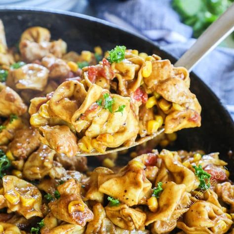 YUM! This easy one skillet dinner is perfect for busy weeknights! Chicken Taco Tortellini brings all the flavor of tacos and locks it in a creamy sauce flavored with taco seasoning. Tender chicken, delicious tortellini, charred corn, zesty tomatoes with green chiles, and creamy alfredo sauce seasoned with taco seasoning. With only a few ingredients this easy skillet dinner comes together in as little as 30 minutes! With all the flavor of tacos, creamy sauce and tortellini this easy chicken ... Chicken Taco Tortellini, Chicken Tortellini Recipes Healthy, Spicy Chicken Tortellini, Cheese Tortellini With Chicken Recipes, Taco Tortellini, Chicken Filled Tortellini Recipes, Easy Chicken Breast Dinner, Easy Skillet Dinner, Creamy Alfredo Sauce