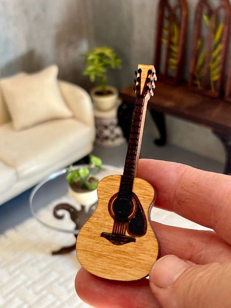 Excited to share this item from my #etsy shop: Dollhouse miniature wooden acoustic Guitar #wooden #fancy #dollhousemusicroom #dollhousedecor #miniguitar #dollhouseguitar Wooden Angel Wings, Custom Table Top, Wooden Angel, Nevada City, Dollhouse Decor, Doll Furniture, Ceramic Decor, Miniature Dolls, Acoustic Guitar