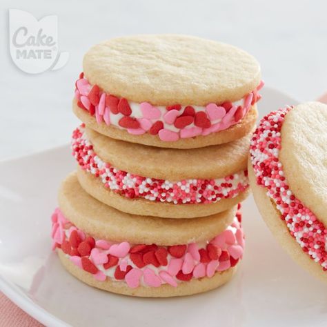 Valentine’s Day Mini Desserts, Valentine Sandwich Cookies, Valentines Bakery Treats, Crumbl Valentine Cookies, Valentine Sandwiches, Mini Heart Cookie Cake, Valentine Bake Sale, Valentines Bakery Ideas, Mini Valentine Cakes