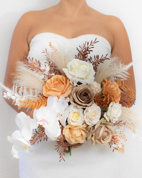 Composed by silk flowers: roses, spray roses, artificial pampas gras and fillers in ivory, earthy brown, orange, and light orange. Silk flowers for rent in Cancun, Riviera Maya and Tulum wedding. Light Orange Flower Bouquet, Orange And Cream Wedding Flowers, Light Orange Wedding Theme, Light Brown Wedding Theme, Orange Bride Bouquet, Orange And Cream Wedding, Tan Wedding Colors, Classy Weddings, Orange Rose Bouquet