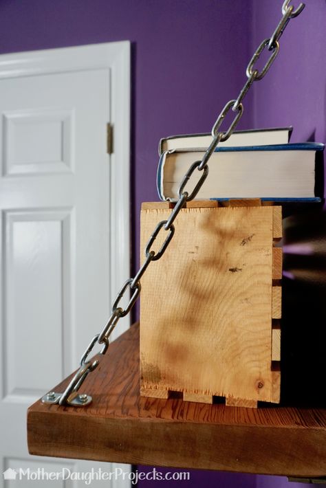 Video tutorial! Learn how to make a statement bookshelf with metal chain! #rustic #industrial #shelf Chain Shelf Hanging Shelves, Chain Hanging Shelves, Chain Shelves, Statement Bookshelf, Plank Tv, Chicken Table, Rustic Industrial Furniture, Hanging Wood Shelves, Diy Computer Desk