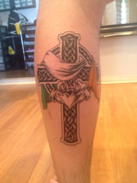 Celtic cross with claddagh and Irish flag Irish Tattoos For Men Traditional, Irish Leg Tattoos, Irish Forearm Tattoo, Irish Flag Tattoo, Irish Calladagh Tattoo, Celtic Cross Forearm Tattoo, Irish Claddagh Tattoo, Celtic Cross Tattoo For Men, Welsh Tattoo